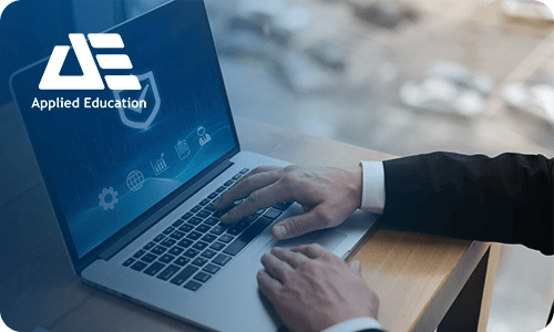 Professional using a laptop with cyber security icons on screen