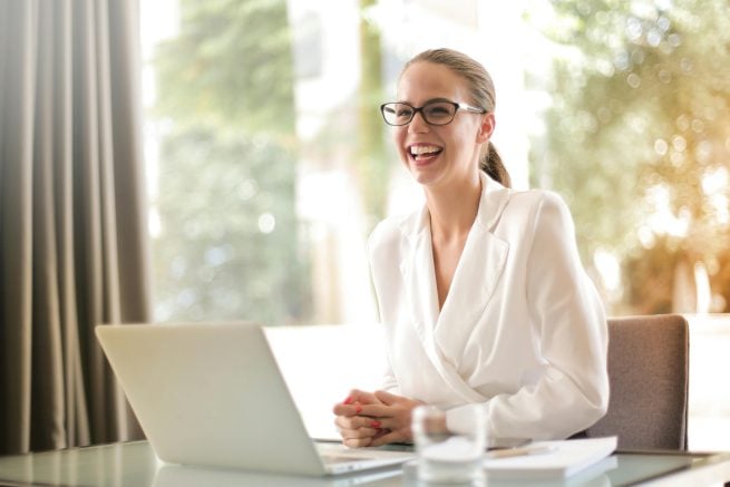 a trainer in front of her laptop